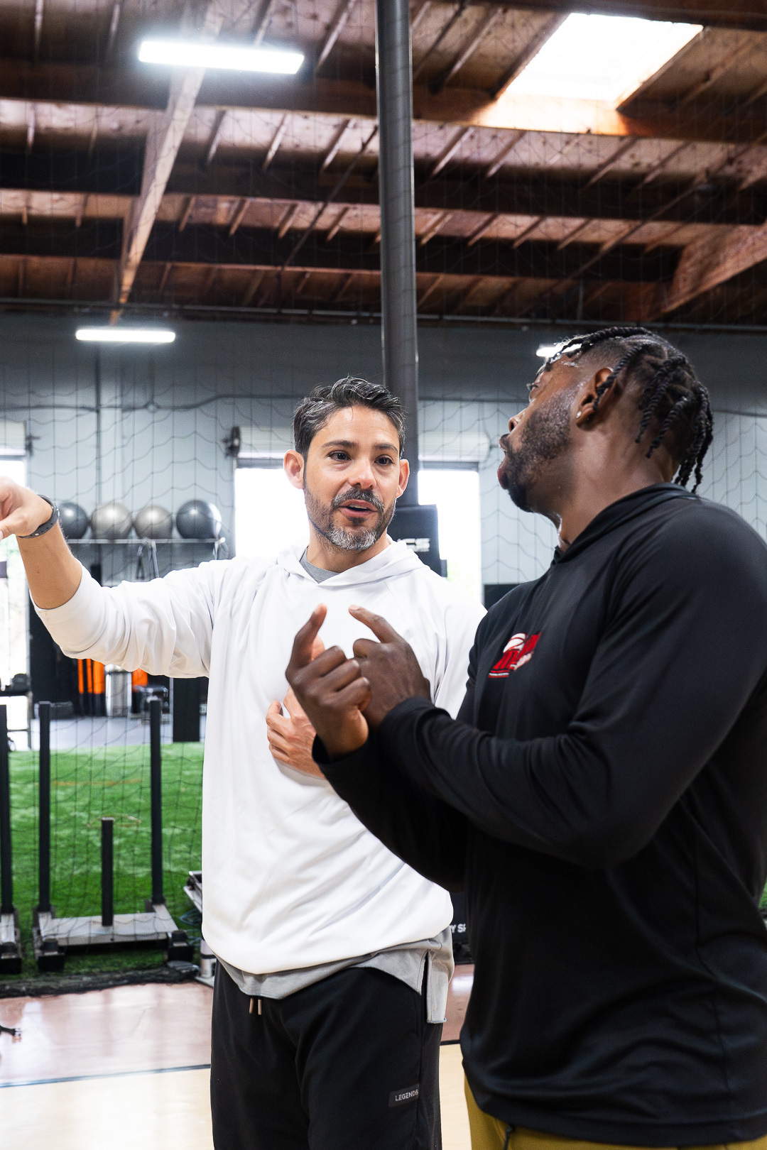 Coach Josh breaking down a move with a coach
