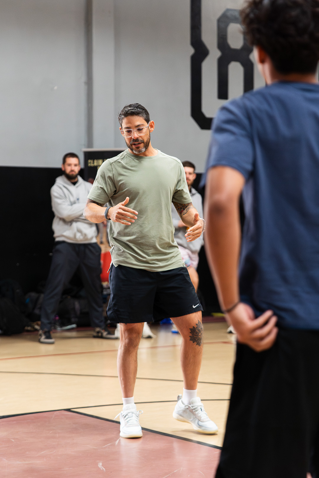 Coach Joshua Mercado coaching on court